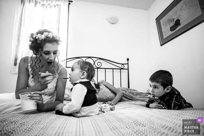 Photo by: <a href="https://www.wpja.com/contests/2019-v14/best-wedding-photographers/2552434">Boni Bonev - Sofia Sofia</a> Bojenci Vilage, Bulgaria Wedding Day Photography - Bride and Kids Waiting for the groom