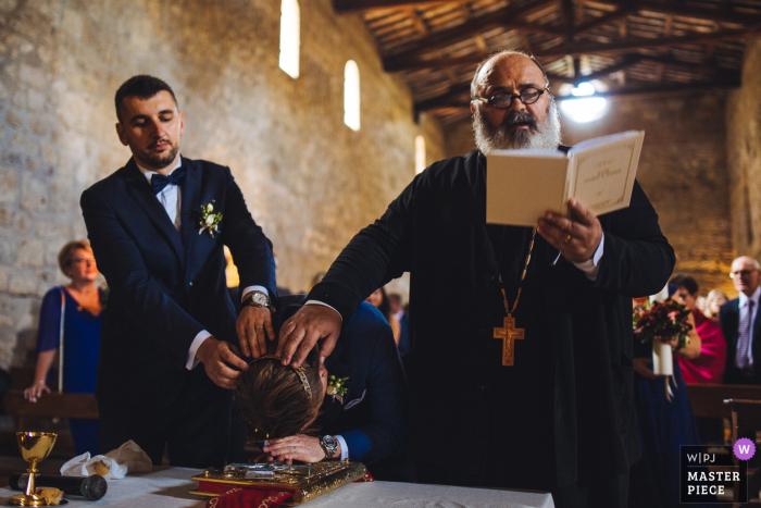 Photo by: <a href="https://www.wpja.com/contests/2019-v14/best-wedding-photographers/2552848">Massimiliano Esposito - Orvieto Terni</a> Church Photography from the Ceremony - Abbazia San Giusto - bow to the holy book