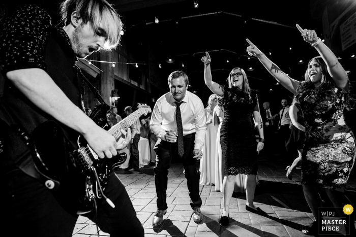Photo by: <a href="https://www.wpja.com/contests/2019-v14/best-wedding-photographers/2553033">Trent Gillespie - Silverthorne Colorado</a> Tenmile Station, Breckenridge, CO | Candid Wedding Photography | The wedding guests getting down to the live band during the reception.