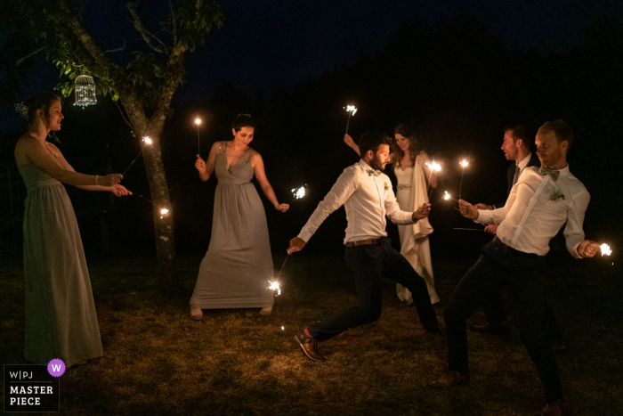 Photo by: <a href="https://www.wpja.com/contests/2019-v14/best-wedding-photographers/2553130">Valerie Teppe - Limoges </a> Domaine de Grolhier Wedding Photographer - Playing with sparkles is so funny!
