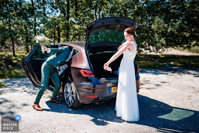Photo by: <a href="https://www.wpja.com/contests/2019-v14/best-wedding-photographers/2553139">Natalja van Ommeren - Zwartewaal Zuid Holland</a> Netherlands - de hei wedding photography of bride and groom at the car