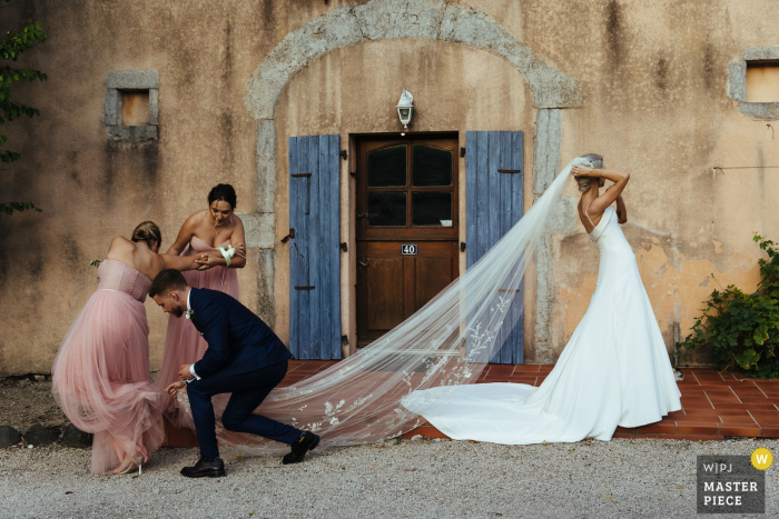 Photo by: <a href="https://www.wpja.com/contests/2019-v14/best-wedding-photographers/2553288">Lyndsey Goddard - London London</a> Chateau de Bijou, France Wedding Reportage - Photography of bridesmaid's heel in bride's veil