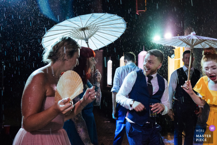 Photo by: <a href="https://www.wpja.com/contests/2019-v14/best-wedding-photographers/2553292">Lyndsey Goddard - London London</a> Wedding photos from Chateau de Bijou, France - dancing in the rain