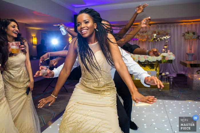 Photo by: <a href="https://www.wpja.com/contests/2019-v14/best-wedding-photographers/2553511">Obi Nwokedi - London London</a> Wedding Reportage Photographer for DoubleTree by Hilton, Docklands, London - Image of bridesmaids dancing
