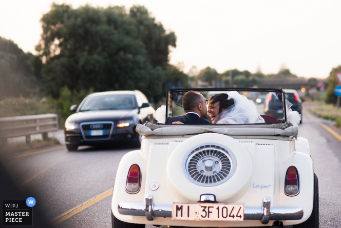 Photo by: <a href="https://www.wpja.com/contests/2019-v14/best-wedding-photographers/2554144">Francesco Survara - Rome Roma</a> Locorotondo convertible car ride for the bride and groom - Wedding photos showing driving through apulia region