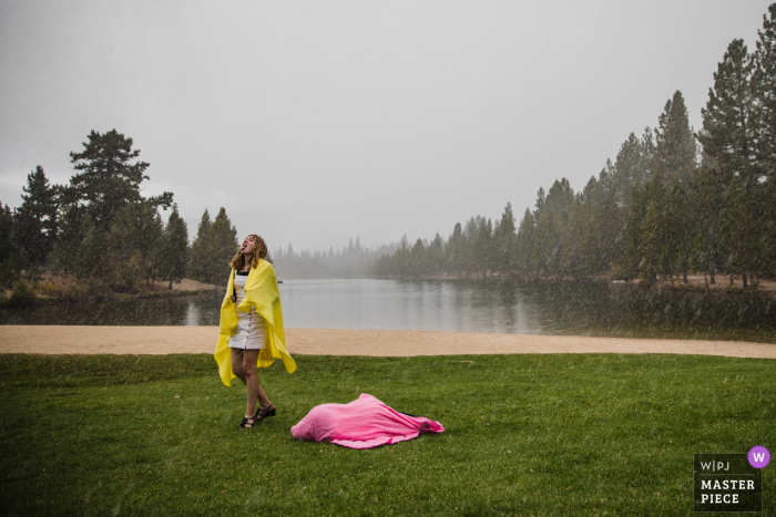 Photo by: <a href="https://www.wpja.com/contests/2019-v14/best-wedding-photographers/2554232">Nicky Byrnes - Carnelian Bay California</a> Tahoe Paradise Park: South Lake Tahoe, CA - Wedding Photojournalism -Young wedding guests play in an unexpected September snowstorm, shielded by colorful blankets.