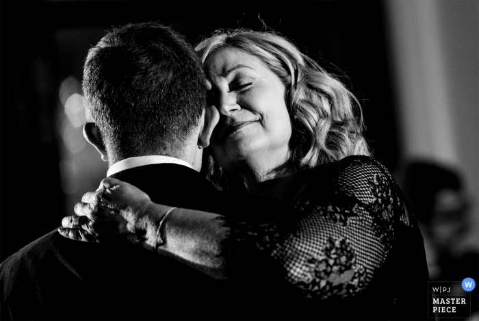 North Carolina Wedding Photojournalism at the Charlotte City Club - The groom dances with his mother. 