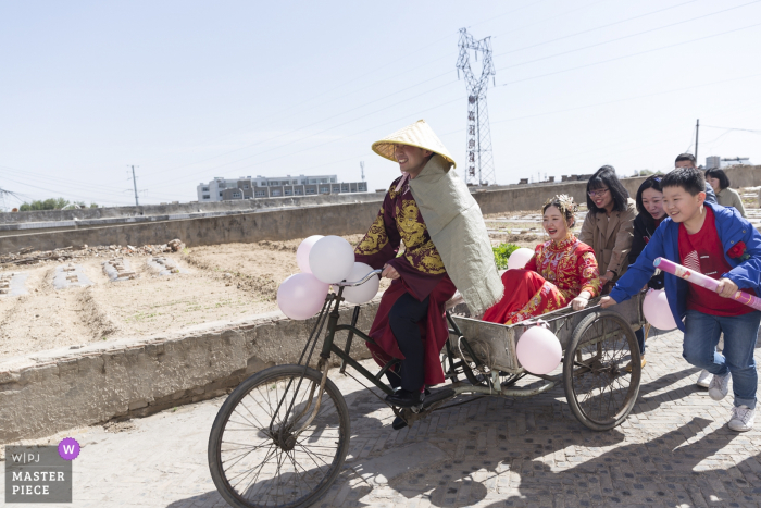 Photo by: <a href="https://www.wpja.com/contests/2019-v14/best-wedding-photographers/2554349">Zhiwen Liu - Yulin </a> Shaanxi Wedding Photography - Wedding car / bike with the bride