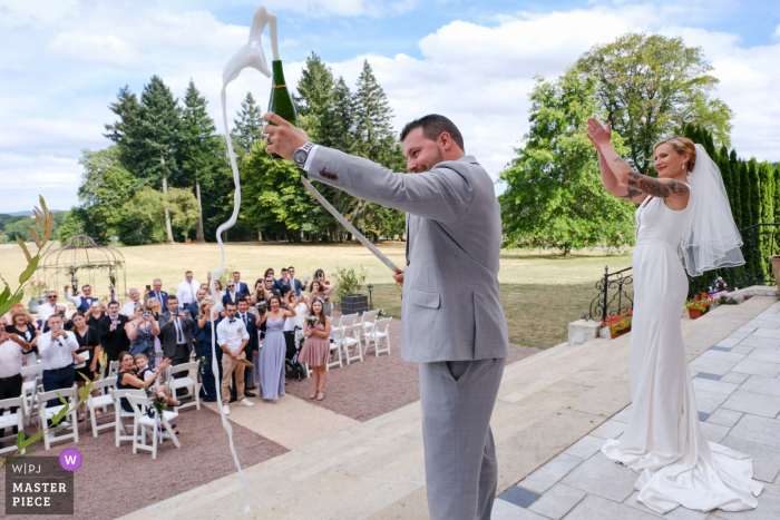 the champagne toast begins with the bottle opening Wedding venue photographer: Château La Cazine Champaign!!!