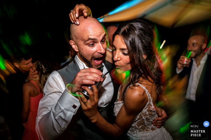Photo by: <a href="https://www.wpja.com/contests/2019-v15/best-wedding-photographers/2555357">Alessandro Iasevoli - Roma Roma</a> Wedding Location of Reception in Rome - Photography of Bride and Groom dancing and drinking