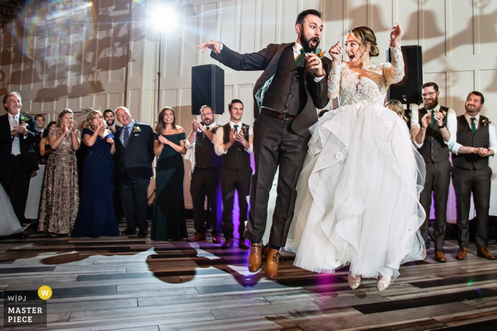 Photo by: <a href="https://www.wpja.com/contests/2019-v15/best-wedding-photographers/2555934">Todd Laffler - High Bridge New Jersey</a> Wedding Reception Venue - Bride and Groom jump together right after being ontroduced into the reception