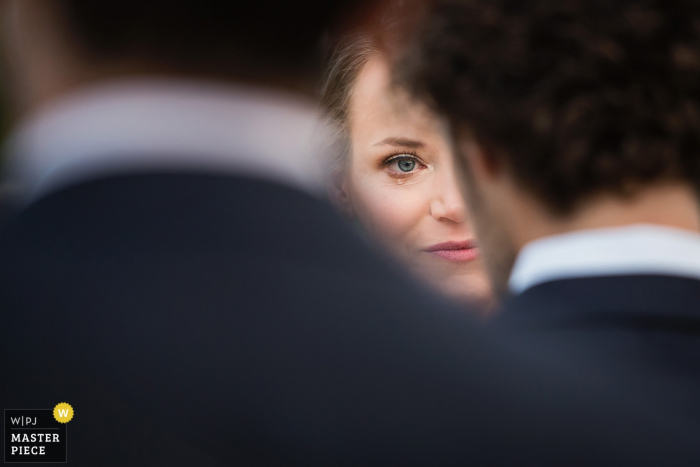 Photo by: <a href="https://www.wpja.com/contests/2019-v15/best-wedding-photographers/2555937">Todd Laffler - High Bridge New Jersey</a> Ceremony photography — Bride sheds a tear while looking at groom during ceremony