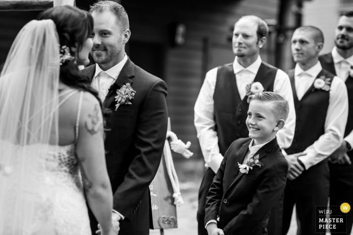 Photo by: <a href="https://www.wpja.com/contests/2019-v15/best-wedding-photographers/2556008">Lauren Lindley - South Lake Tahoe California</a> Black Bear Lodge, South Lake Tahoe, CA wedding ceremony photo of a bride's son looks on expectantly during their wedding ceremony in Lake Tahoe, CA