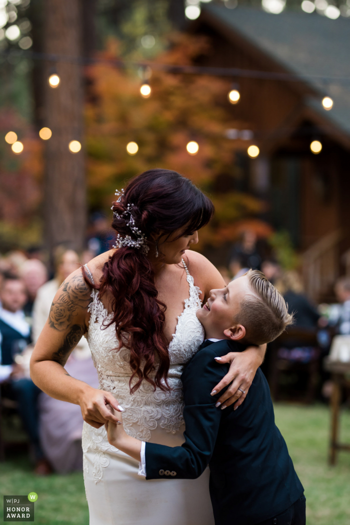 A mother/son first dance during her wedding reception. Black Bear Lodge, South Lake Tahoe, CA outdoor wedding venue photo | A mother/son first dance during her South Lake Tahoe, CA wedding reception.