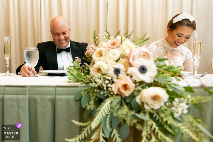 the bride and groom reacting to the toast Newnan Centre reception photo of the bride and groom reacting to the toast