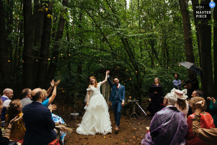 Photo by: <a href="https://www.wpja.com/contests/2019-v15/best-wedding-photographers/2556909">Lyndsey Goddard - London London</a> A couple celebrates after the wedding ceremony at the The Dreys, Kent - outdoor photography