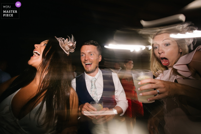 wedding venue photography at the Castello del Trebbio, Tuscany — wedding guests dancing