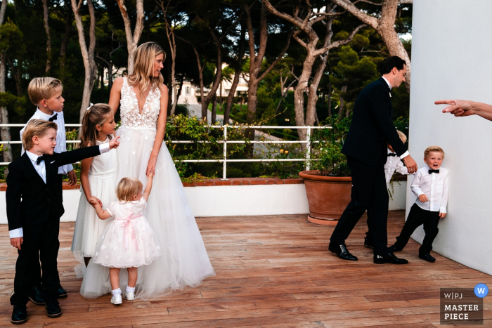 Photo by: <a href="https://www.wpja.com/contests/2019-v15/best-wedding-photographers/2557307">Yves Schepers - Bonheiden Antwerpen</a> Wedding Photography from Flanders Reception - - The little boy does not wan to cooperate for the family portrait and his mother demands he listens and points to the others that are waiting for him