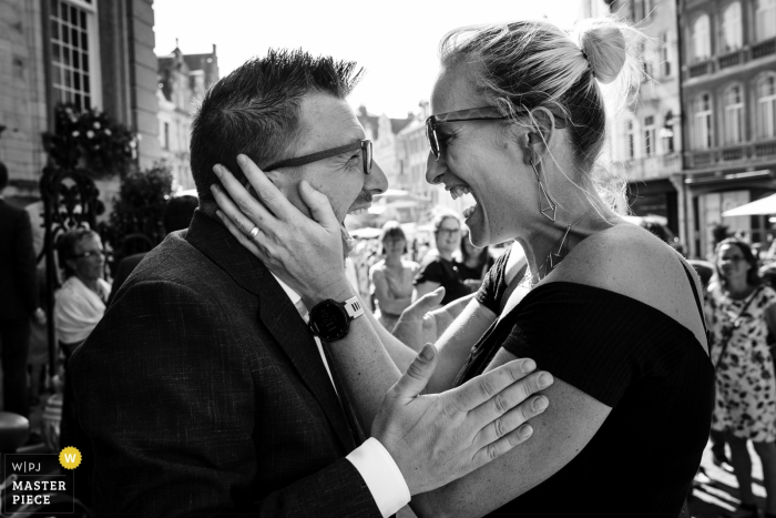 Groom and bridesmaid greet each other ecstatically right after the civil wedding Flanders Ceremony - wedding photographer - Groom and bridesmaid greet each other ecstatically right after the civil wedding