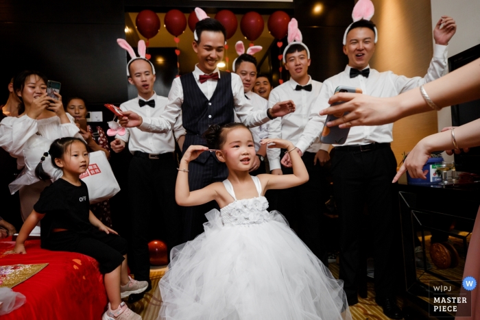 Fujian, China Wedding young girl at wedding reception Fujian, China Wedding Photojournalism