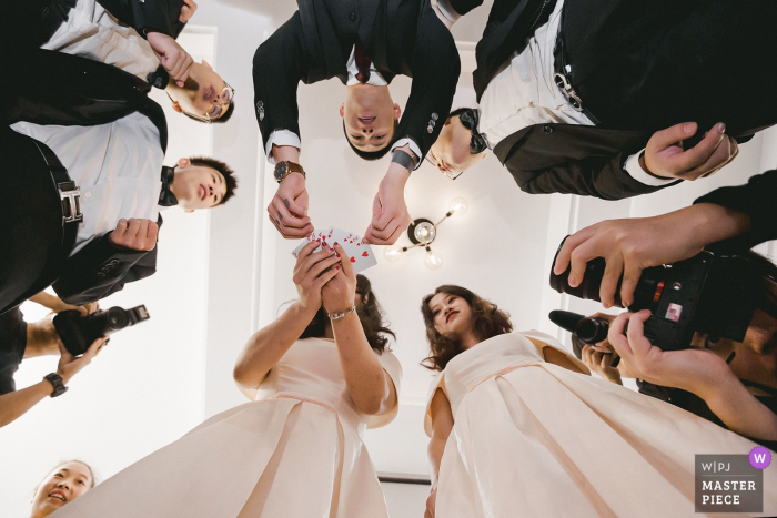 Photo by: <a href="https://www.wpja.com/contests/2019-v16/best-wedding-photographers/2560396">Qi Xiang - Nanping </a> Fujian wedding photographer | Card game on wedding reception for bridal party