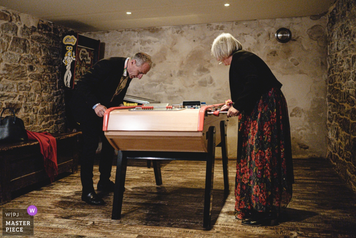 Photo by: <a href="https://www.wpja.com/contests/2019-v16/best-wedding-photographers/2560491">Didier Ropers - Lorient </a> Brittany wedding photography | Waiting for the ceremony while playing foosball