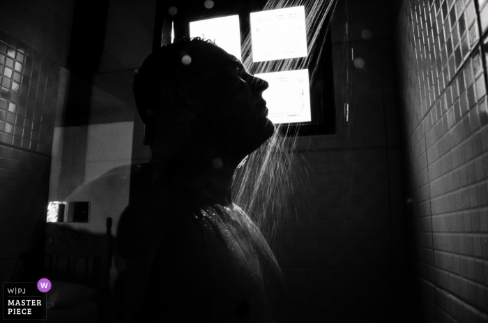 Photo by: <a href="https://www.wpja.com/contests/2019-v16/best-wedding-photographers/2560700">Lucas Coutinho - Nova Friburgo Rio de Janeiro</a> Brazil Hotel / Reception Venue Photography – Groom in the shower getting ready for the ceremony