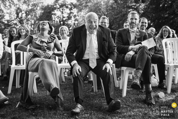 Photo by: <a href="https://www.wpja.com/contests/2019-v16/best-wedding-photographers/2560958">Ronan Jégaden - Athis-Mons </a> Amien Outdoor Wedding Ceremony Photography of Guests Laughing