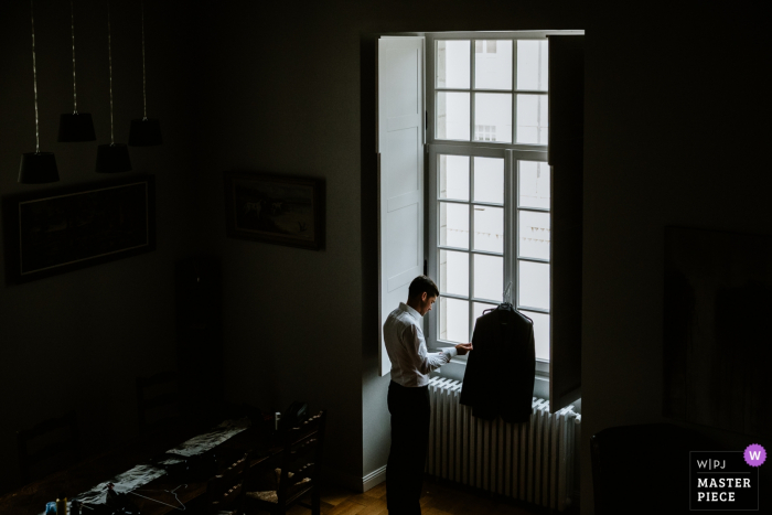 Photo by: <a href="https://www.wpja.com/contests/2019-v16/best-wedding-photographers/2561152">Karol Robache - Cucuron </a> Wedding Photographer making pictures of the groom in Castel Jalesnes