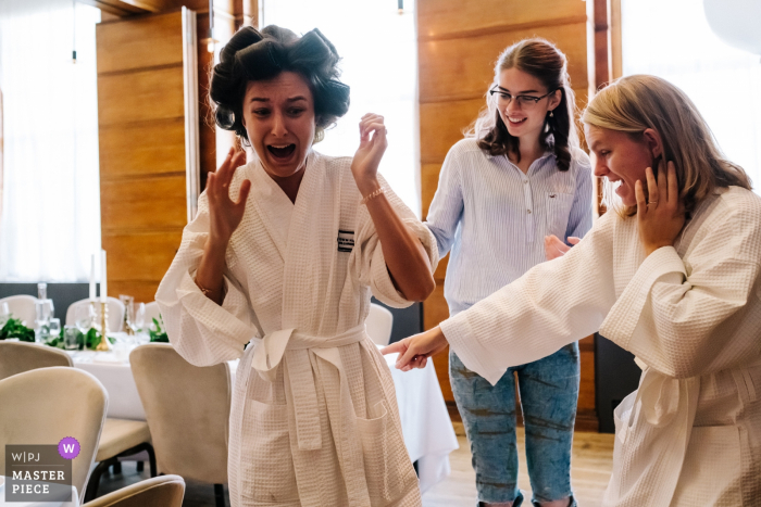 Photo by: <a href="https://www.wpja.com/contests/2019-v16/best-wedding-photographers/2561572">Kristian Leven - London</a> England Town Hall Hotel Wedding Photography - The Bride discovers a grasshopper in her bath robe