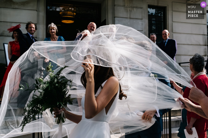 Photo by: <a href="https://www.wpja.com/contests/2019-v16/best-wedding-photographers/2561576">Kristian Leven - London</a> England Town Hall Hotel Wedding Photos - Veil in full flight