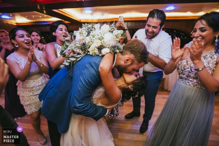Photo by: <a href="https://www.wpja.com/contests/2019-v16/best-wedding-photographers/2561818">Derya Engin - Istanbul</a> Boat wedding on the Bosphorus - Wedding photo of the big kiss at the end of the day