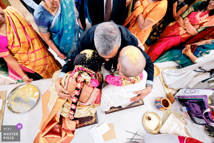 Photo by: <a href="https://www.wpja.com/contests/2019-v16/best-wedding-photographers/2561924">Clive Blair - Birmingham West Midlands</a> Tividale Balaji Temple Wedding Ceremony Photos | Bride and groom being blessed by guests