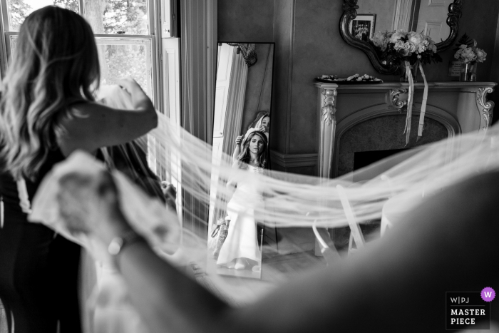 Photo by: <a href="https://www.wpja.com/contests/2019-v16/best-wedding-photographers/2562075">JD Land - Marlton New Jersey</a> Bride Getting Ready Photography from NJ - Bride having her veil put on by the MOH and her Mom.