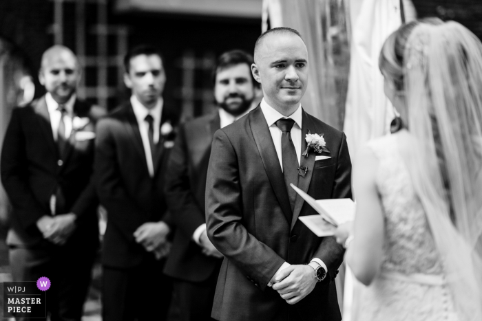 Photo by: <a href="https://www.wpja.com/contests/2019-v16/best-wedding-photographers/2562083">JD Land - Marlton New Jersey</a> NJ Wedding Ceremony Photographer - Groom shedding a tear while the bride reads her vows and the Groomsmen look on.