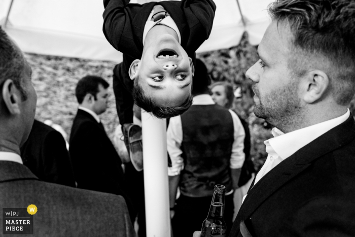 Photo by: <a href="https://www.wpja.com/contests/2019-v16/best-wedding-photographers/2562107">Karen Flower - Thames Ditton Surrey</a> Rumbolds Farm, Surrey wedding photographer - guests at reception having fun in black and white