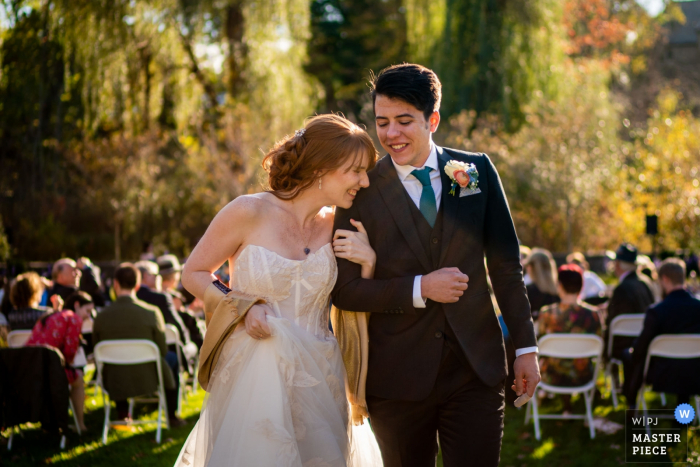 Photo by: <a href="https://www.wpja.com/contests/2019-v16/best-wedding-photographers/2562382">Johnny Shryock - Arlington Virginia</a> Vassar College, Poughkeepsie, NY wedding photographer | An emotional bride and groom exit their wedding ceremony
