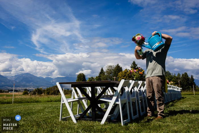 Photo by: <a href="https://www.wpja.com/contests/2019-v16/best-wedding-photographers/2562384">David Clumpner - Missoula Montana</a> Corvallis, Montana wedding photographer - Photo of the groom watering flowers
