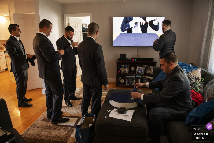 Photo by: <a href="https://www.wpja.com/contests/2019-v17/best-wedding-photographers/2562755">Simi Rabinowitz - Somerville Massachusetts</a> Wedding Photography from the Groom's Home, Taunton, Massachusetts | Groomsmens folding pocket squares