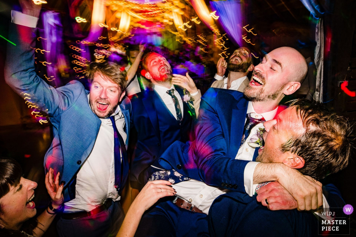 Photo by: <a href="https://www.wpja.com/contests/2019-v17/best-wedding-photographers/2562787">Jonny Barratt - Stroud Gloucestershire</a> Alpheton Hall Barns, UK Dancefloor party photography from the wedding reception venue