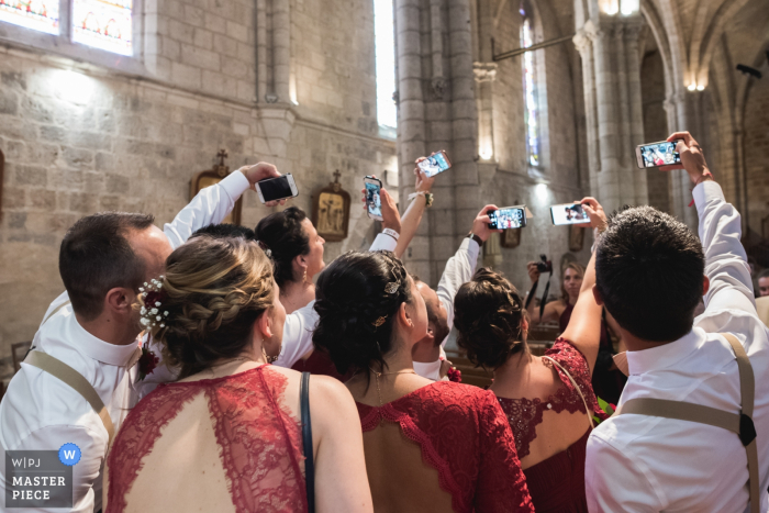Photo by: <a href="https://www.wpja.com/contests/2019-v17/best-wedding-photographers/2563637">Franck Petit - Serignac sur Garonne </a> Chateau de Malliac wedding venue photography - Guests taking group selfies