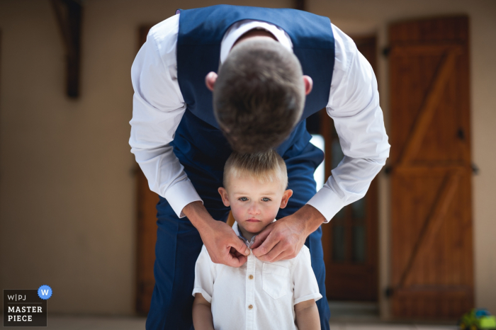Photo by: <a href="https://www.wpja.com/contests/2019-v17/best-wedding-photographers/2563644">Franck Petit - Serignac sur Garonne </a> Château de Walmath, France wedding photos - Helping kids get ready for the ceremony