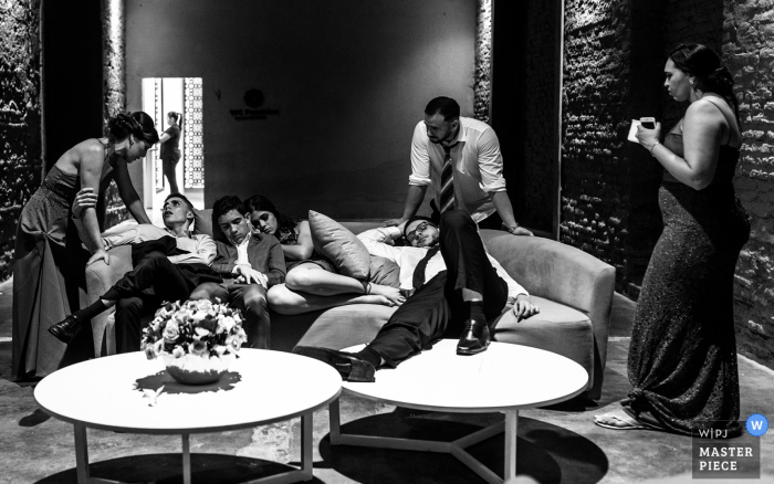 Photo by: <a href="https://www.wpja.com/contests/2019-v17/best-wedding-photographers/2563762">Monica Guimaraes - Maceió Alagoas</a> Brazil Wedding Reception Pictures | End of the party image with guests very tired