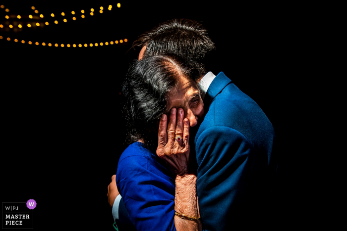 Photo by: <a href="https://www.wpja.com/contests/2019-v17/best-wedding-photographers/2563843">Jesse La Plante - Boulder Colorado</a> Spruce Mountain Ranch (Larkspur, CO) wedding pictures of the Groom hugging his grandmother