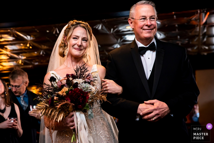 Photo by: <a href="https://www.wpja.com/contests/2019-v17/best-wedding-photographers/2563848">Jesse La Plante - Boulder Colorado</a> Ironworks (Denver, CO) wedding venue photographer: Bride walking down the aisle with her father