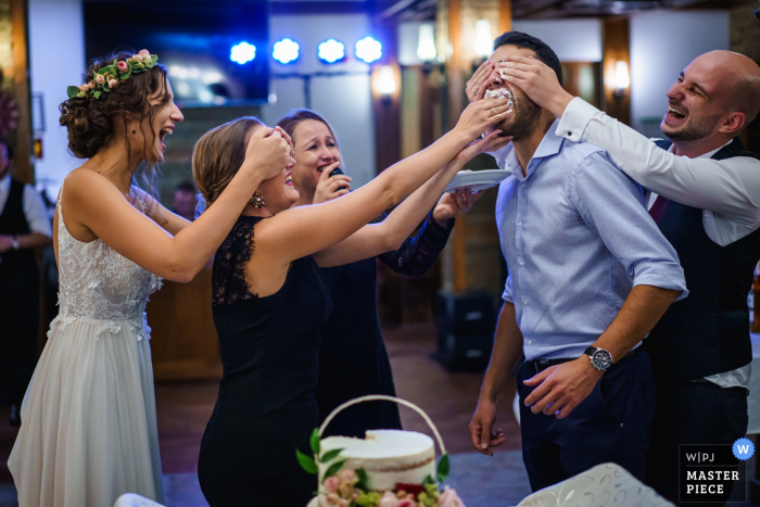 Photo by: <a href="https://www.wpja.com/contests/2019-v17/best-wedding-photographers/2563880">Boni Bonev - Sofia Sofia</a> Bojenci Vilage, Bulgaria wedding pictures at the reception of The cake emotions