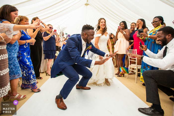 Photo by: <a href="https://www.wpja.com/contests/2019-v17/best-wedding-photographers/2563898">Obi Nwokedi - London London</a> England wedding reportage photography at the Groom's home - Bride and groom entrance