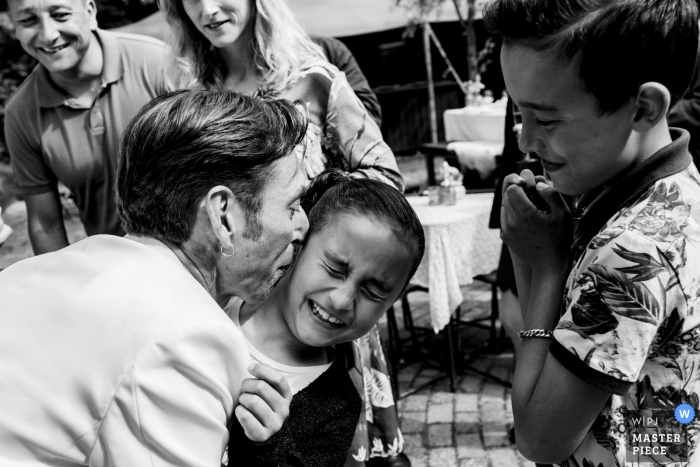 Photo by: <a href="https://www.wpja.com/contests/2019-v17/best-wedding-photographers/2564052">Moniek van Gils - Klundert Noord Brabant</a> Netherlands Wedding Reception Photography with Kids | This girl didn't want to have a kiss from her uncle the groom