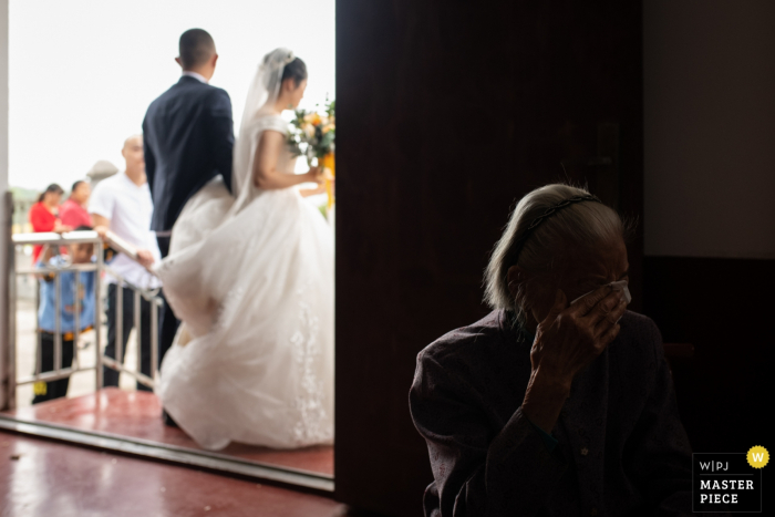 Photo by: <a href="https://www.wpja.com/contests/2019-v17/best-wedding-photographers/2564137">Zefan Tang - Changsha </a> changsha wedding moment - photography at the ceremony with crying relative and bride and groom