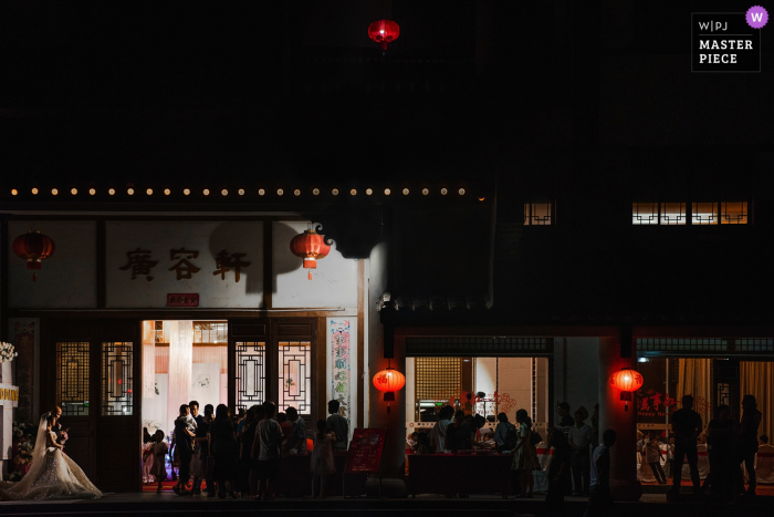 Photo by: <a href="https://www.wpja.com/contests/2019-v17/best-wedding-photographers/2564197">Kai Xiao - Sanming </a> Fujian wedding hotel reception photography at night with the bride and groom